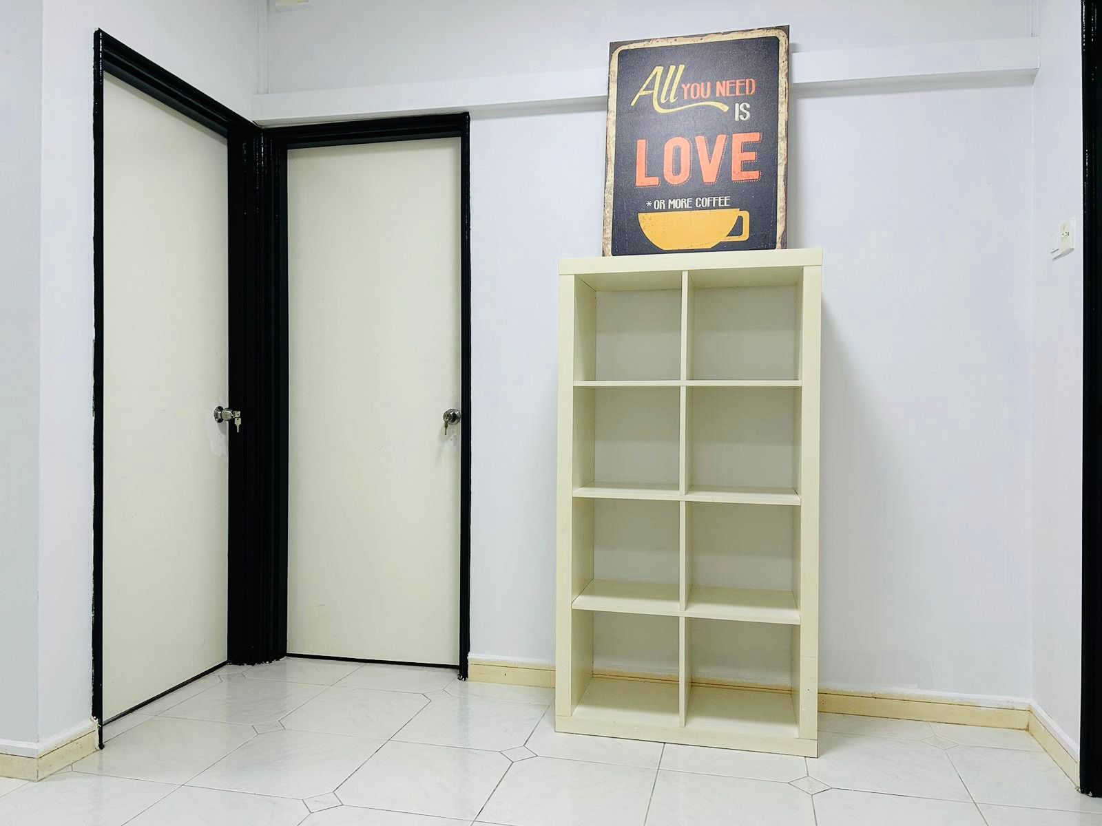 Common area at Orchid Park 1 — shelf unit and doors