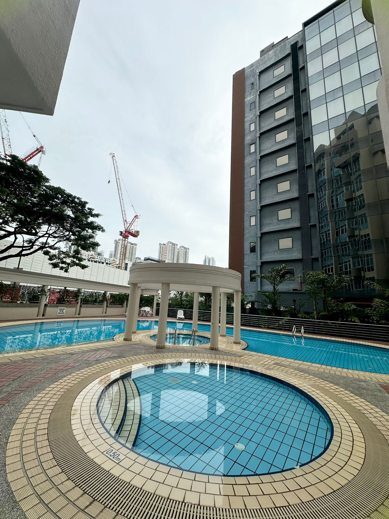 Harvest Mansions condominium — pool pavilion with surrounding towers
