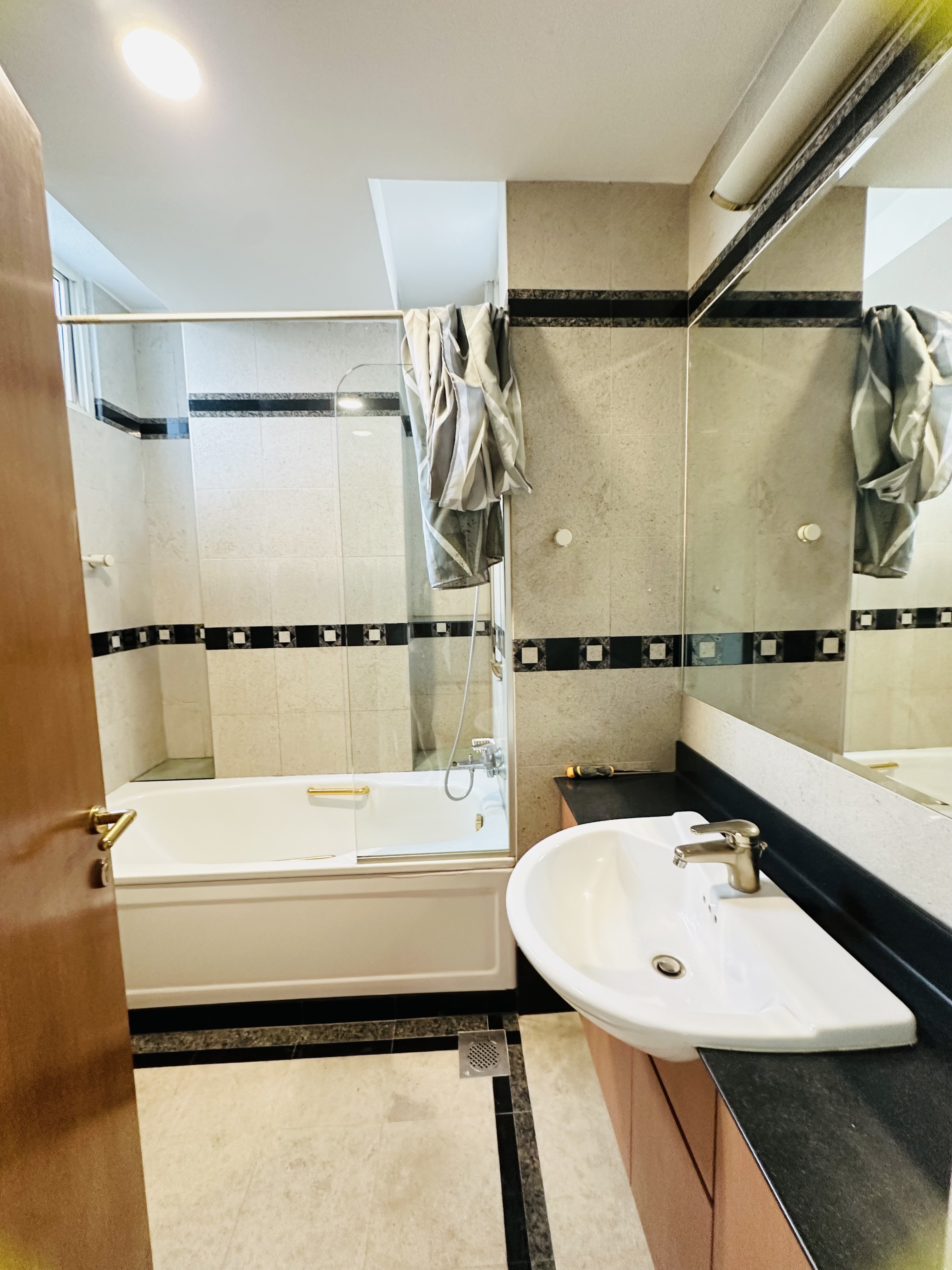 Shared toilet 2 at Harvest Mansions — bathtub and vanity basin