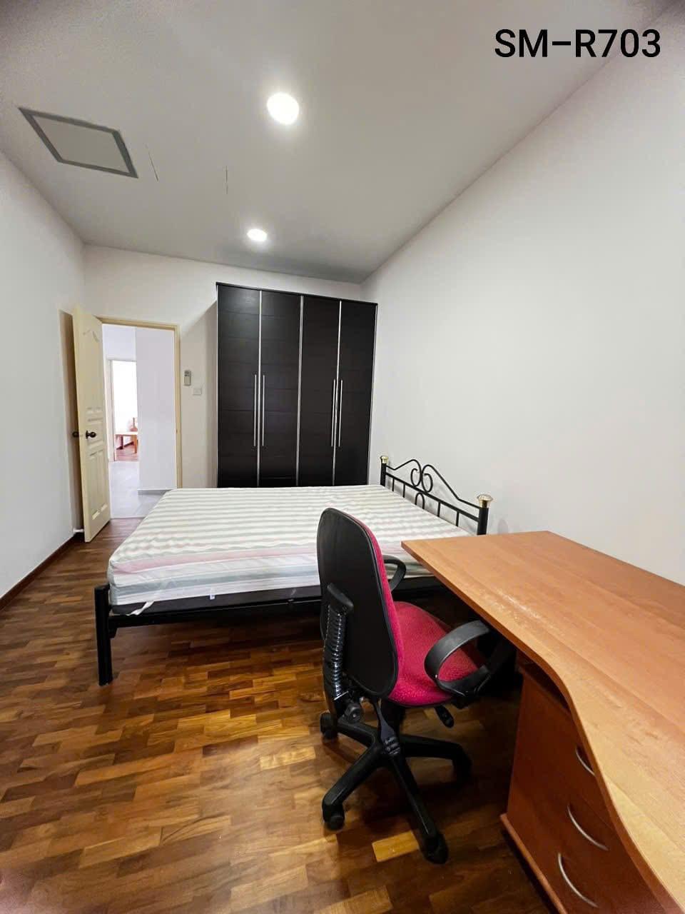 Room 703 — bed, dark wardrobe and study desk