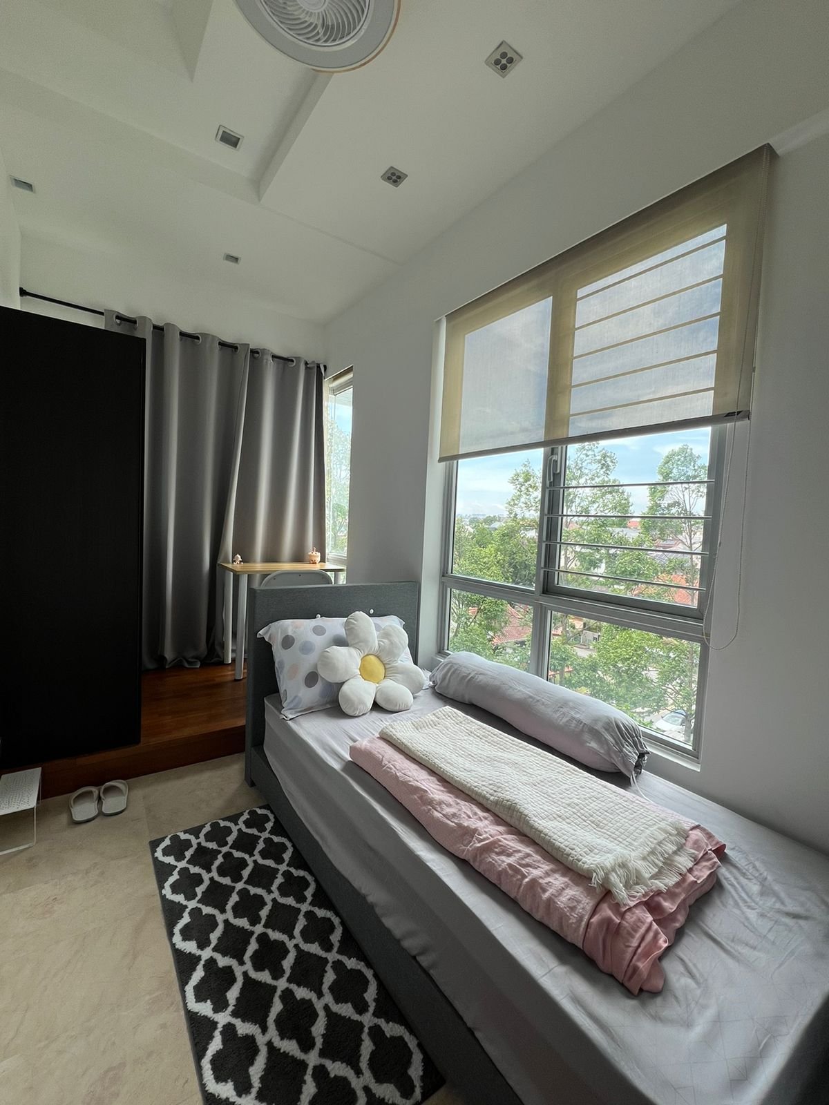 Room 502 — single bed, wardrobe and window