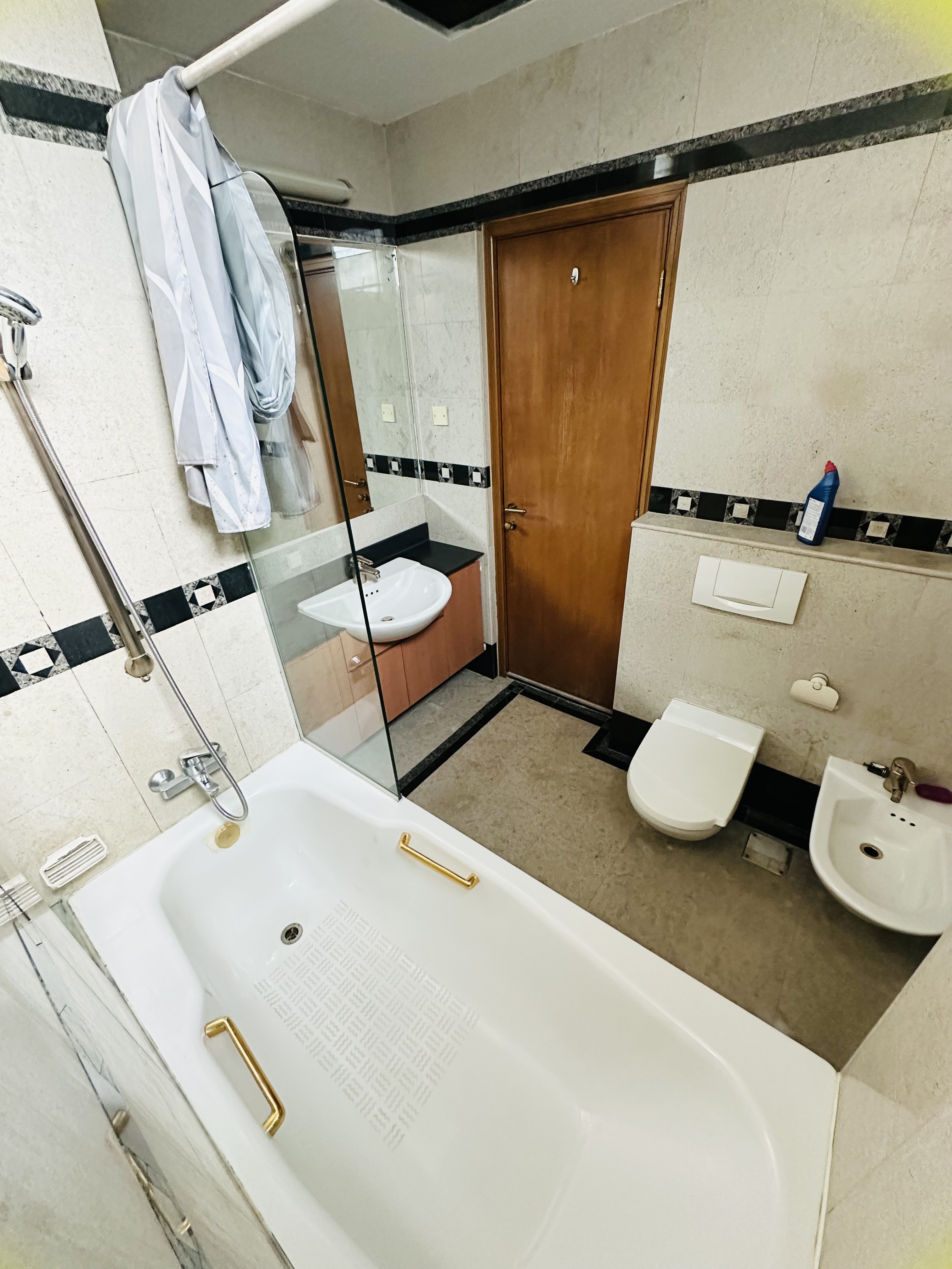 Shared toilet 1 at Harvest Mansions — bathtub, shower and vanity basin